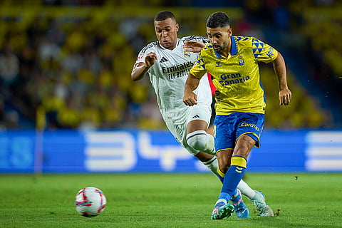 La liga 2024-25: Las Palmas' Alex Suarez, right, is challenged by Real Madrid's Kylian Mbappe